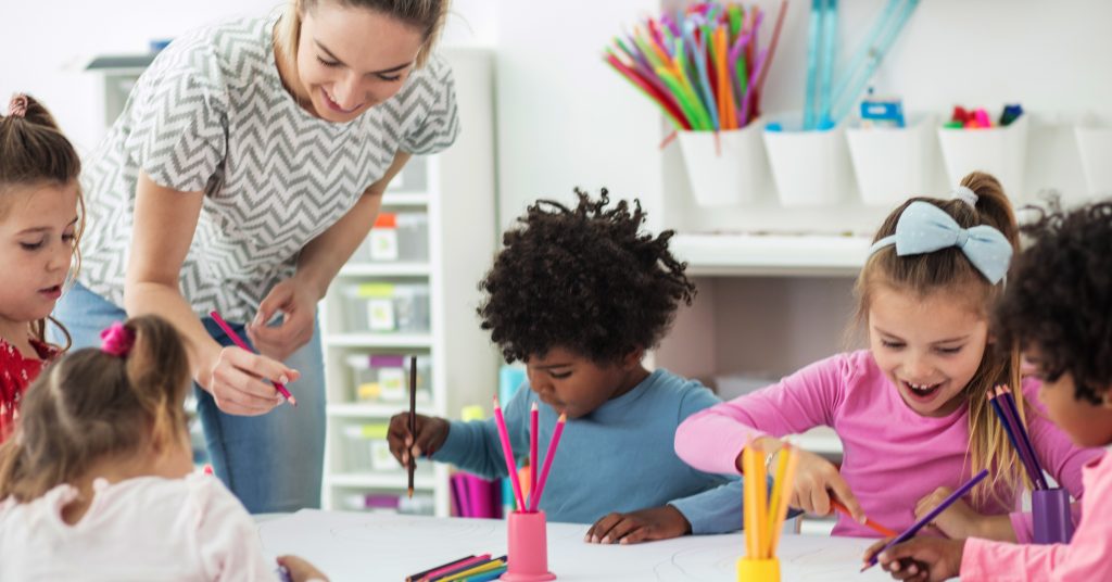 Image of woman and children playing